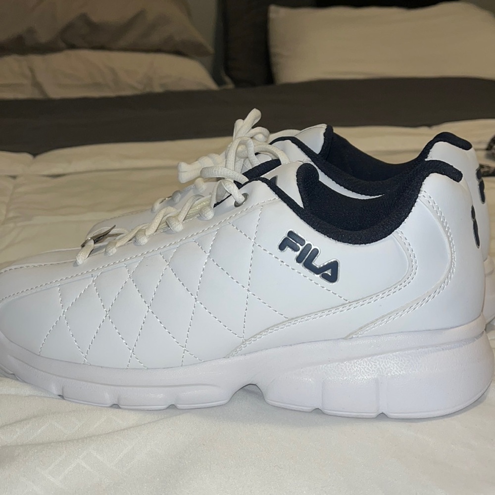 Fila sneakers. Ordered a wrong size. Never one outside. 8.5 men’s